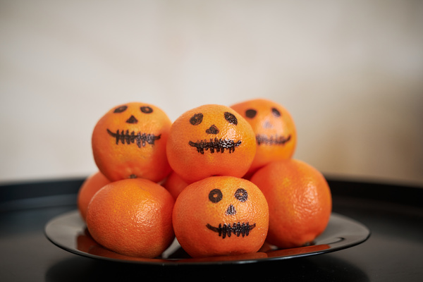 Plate of Tangerines with Painted Faces